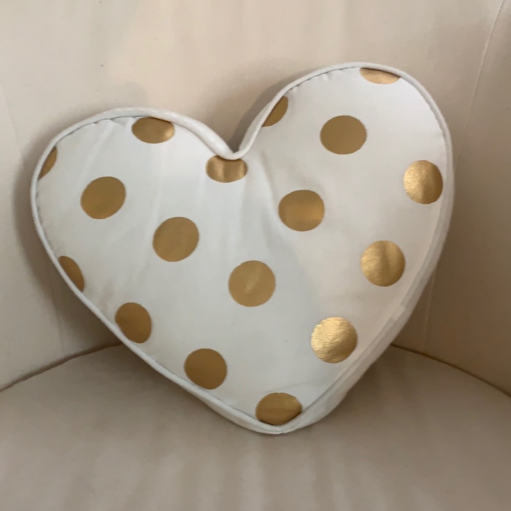 I am selling a in great condition cute gold and white heart pillow!!!